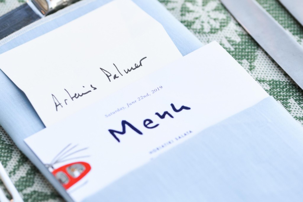 Light blue linen napkin with white stitching - Image 1